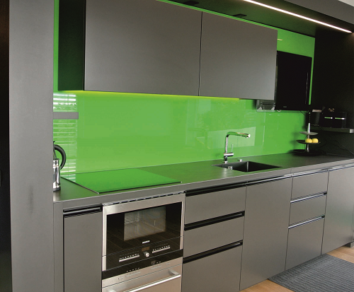 Kitchen design by IG Kitchens with green panels